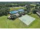Aerial view of tennis and basketball courts at 5120 Tanzanite Dr, Mount Dora, FL 32757