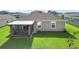 Aerial view showcasing the home's backyard, screened porch, and landscaping at 5120 Tanzanite Dr, Mount Dora, FL 32757