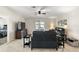 Relaxing living room featuring a black leather sectional sofa and access to a patio at 5120 Tanzanite Dr, Mount Dora, FL 32757