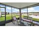 Spacious screened porch with seating area and backyard view at 5120 Tanzanite Dr, Mount Dora, FL 32757