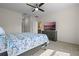 Main bedroom with a large bed, dresser, and a TV at 1565 Tali Ln, Mount Dora, FL 32757
