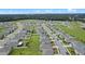 Aerial view of a large residential neighborhood with houses, roads, and green spaces at 1565 Tali Ln, Mount Dora, FL 32757