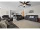 Living Room with gray couches and a view of kitchen at 1565 Tali Ln, Mount Dora, FL 32757