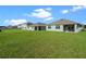 Spacious backyard with large grassy area and privacy fence at 1565 Tali Ln, Mount Dora, FL 32757