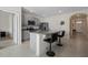 Modern kitchen with breakfast bar and granite countertops at 1565 Tali Ln, Mount Dora, FL 32757