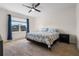 Spacious bedroom with king-size bed and ceiling fan at 1565 Tali Ln, Mount Dora, FL 32757