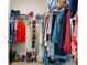 Walk-in closet with ample hanging space and shoe rack at 1565 Tali Ln, Mount Dora, FL 32757