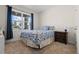 Cozy bedroom with a double bed and window with natural light at 1565 Tali Ln, Mount Dora, FL 32757