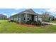 Gray one-story house with white garage door at 1565 Tali Ln, Mount Dora, FL 32757