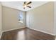 Spacious bedroom with hardwood floors and ceiling fan at 34416 Tuscany Ave, Sorrento, FL 32776