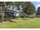 This home boasts a beautifully landscaped backyard at 34416 Tuscany Ave, Sorrento, FL 32776
