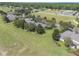 Aerial view of home and community, showcasing landscaping and neighborhood at 34416 Tuscany Ave, Sorrento, FL 32776