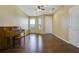 Spacious living room with hardwood floors and a piano at 34416 Tuscany Ave, Sorrento, FL 32776