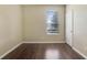 Bright bedroom with hardwood floors and window at 34416 Tuscany Ave, Sorrento, FL 32776