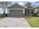 Craftsman style home with brick and gray siding at 34416 Tuscany Ave, Sorrento, FL 32776