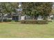 Expansive backyard with lush grass and manicured landscaping at 34416 Tuscany Ave, Sorrento, FL 32776