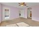 Primary bedroom with private access to patio and bathroom at 540 Grand Canal Dr, Kissimmee, FL 34759