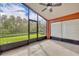 Spacious screened patio with a ceiling fan, offering a relaxing outdoor space at 540 Grand Canal Dr, Kissimmee, FL 34759