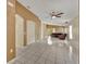 Open living room with tile floors and access to other rooms at 540 Grand Canal Dr, Kissimmee, FL 34759