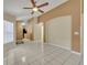Open concept living room with tile floors and neutral colors at 540 Grand Canal Dr, Kissimmee, FL 34759