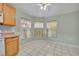 Eat-in kitchen with three windows and ceiling fan at 540 Grand Canal Dr, Kissimmee, FL 34759