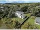 Aerial view of a house with a backyard and a pond nearby at 12332 Basin St, Clermont, FL 34715