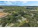 Aerial view showing a neighborhood near a lake at 12332 Basin St, Clermont, FL 34715