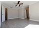 Bright bedroom with ceiling fan and access to bathroom at 15622 Hidden Lake Cir, Clermont, FL 34711