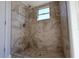 Large shower with tile surround and window at 15622 Hidden Lake Cir, Clermont, FL 34711