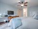 Serene bedroom with king-size bed and ensuite bathroom access at 16 Escondido Cir # 216, Altamonte Springs, FL 32701