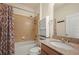 Clean bathroom with a shower/tub combo and granite vanity at 901 Egrets Landing Way, Groveland, FL 34736