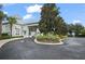 Attractive community entrance with landscaped grounds and curving driveway at 901 Egrets Landing Way, Groveland, FL 34736