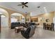 Bright and airy living room with comfortable seating and views into other rooms at 13129 Coldwater Loop, Clermont, FL 34711