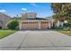 Two-story house with a three-car garage and landscaping at 13129 Coldwater Loop, Clermont, FL 34711