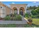 Beautiful home exterior with landscaped yard and walkway at 13129 Coldwater Loop, Clermont, FL 34711