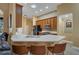 Modern kitchen with quartz countertops and wood cabinets at 13129 Coldwater Loop, Clermont, FL 34711