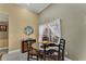 Cozy breakfast nook with a glass-top table and four chairs, perfect for small meals at 13129 Coldwater Loop, Clermont, FL 34711