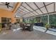 Large covered patio with seating area, perfect for outdoor dining at 13129 Coldwater Loop, Clermont, FL 34711