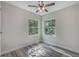 Bright bedroom with gray flooring and large windows at 12332 Basin St, Clermont, FL 34715