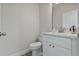 Modern bathroom with white vanity and a contemporary toilet at 12332 Basin St, Clermont, FL 34715