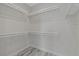 Large walk-in closet with ample shelving for storage at 12332 Basin St, Clermont, FL 34715