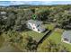 Aerial view of house near a pond and neighboring houses at 12332 Basin St, Clermont, FL 34715