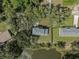 Aerial view of house and surrounding area, near a pond at 12332 Basin St, Clermont, FL 34715