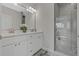 Elegant bathroom with double vanity, frameless shower, and modern fixtures at 12332 Basin St, Clermont, FL 34715