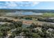 Aerial view of a community near a lake and highway at 12332 Basin St, Clermont, FL 34715
