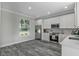 Modern kitchen with stainless steel appliances and white cabinets at 12332 Basin St, Clermont, FL 34715