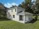 Two-story house with gray roof and covered patio at 12332 Basin St, Clermont, FL 34715