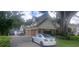 Two story house with attached garage, driveway, and manicured lawn at 2602 Tryon Pl, Windermere, FL 34786