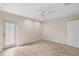 Bedroom with tile floors, door to outside, and ceiling fan at 8222 Florida Boys Ranch Rd, Groveland, FL 34736
