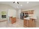Open kitchen with granite countertops and wood cabinets at 8222 Florida Boys Ranch Rd, Groveland, FL 34736